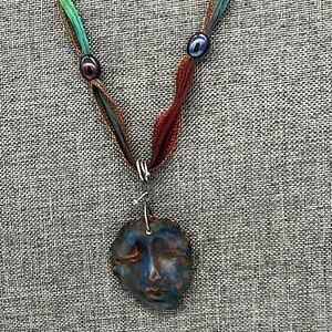 Goddess face necklace made of polymer clay